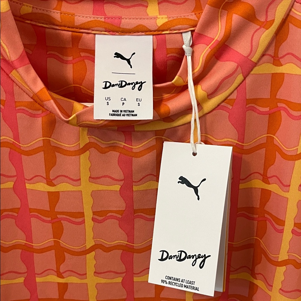 Puma Dani Dazey Woman’s Vibrant Red and Orange Checkered Golf Tee - Picture 2 of 4